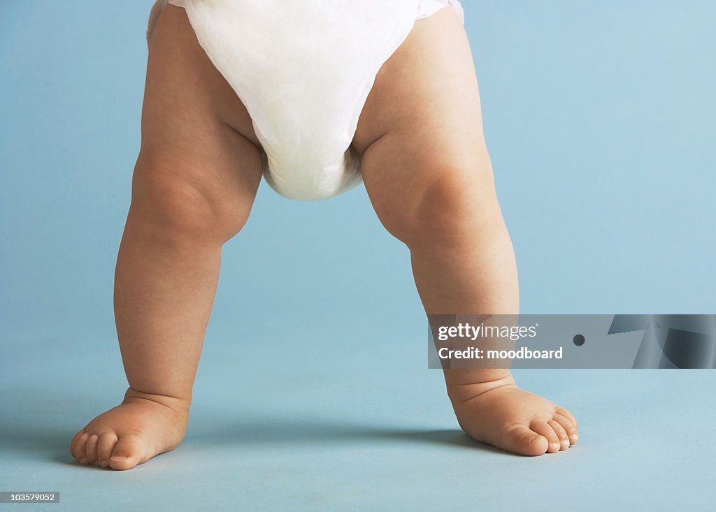 Baby legs with nappy