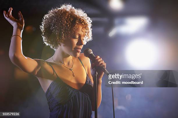 jazz singer on stage, portrait - singer stock pictures, royalty-free photos & images