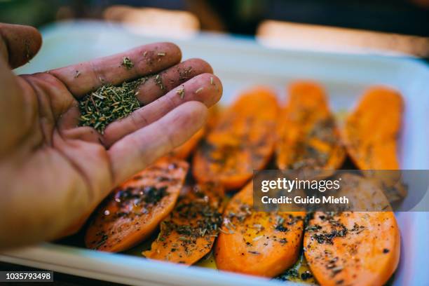 preparing sweet potato for bbq. - rosemary - fotografias e filmes do acervo