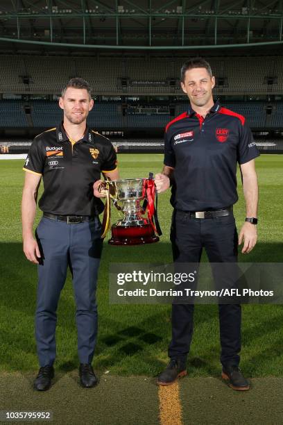 Box Hill Coach Chris Newman and Casey Coach Jade Rawlings pose for a photo during a VFL and VFLW Grand Final press conference at Ikon Park on...