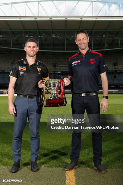 Box Hill Coach Chris Newman and Casey Coach Jade Rawlings pose for a photo during a VFL and VFLW Grand Final press conference at Ikon Park on...