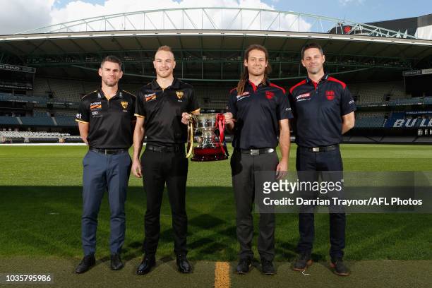 Box Hill Coach Chris Newman, Captain Andrew Moore, Casey Captain Jack Hutchins and Coach Jade Rawlings pose for a photo during a VFL and VFLW Grand...