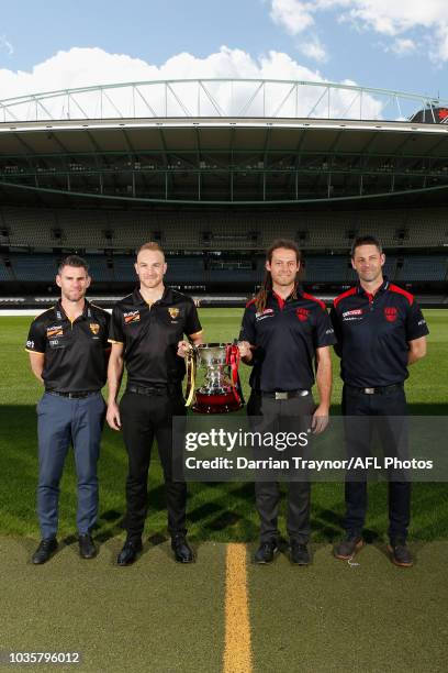 Box Hill Coach Chris Newman, Captain Andrew Moore, Casey Captain Jack Hutchins and Coach Jade Rawlings pose for a photo during a VFL and VFLW Grand...