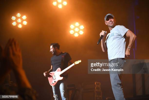 Matthew Ramsey of Old Dominion and Kenny Chesney perform at the Ryman Auditorium on September 18, 2018 in Nashville, Tennessee.