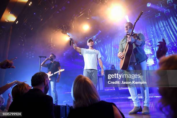 Matthew Ramsey of Old Dominion, Kenny Chesney and Trevor Rosen of Old Dominion perform at the Ryman Auditorium on September 18, 2018 in Nashville,...