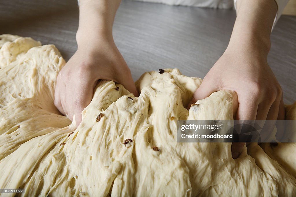 Baker Kneading Bread Dough