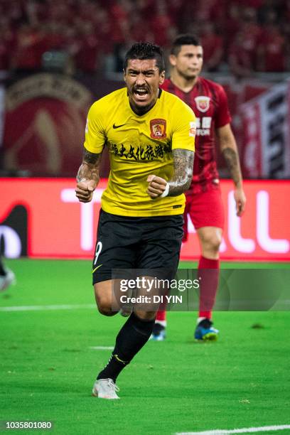 Paulinho of Guangzhou Evergrande Taobao celebrates a goal during the 2018 Chinese Super League match between Shanghai SIPG v Guangzhou Evergrande...