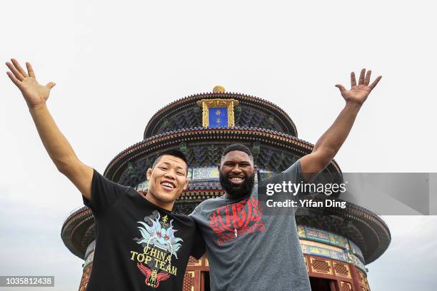 Fighters Li Jingliang of China and Curtis Blaydes of the United States pose for photo during UFC Fight Night Beijing Athlete Tour at Temple of Heaven...
