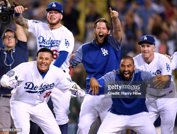 Manny Machado, Matt Kemp, Alex Verdugo, Clayton Kershaw and Chase Utley of the Los Angeles Dodgers, celebrate while waiting for Chris Taylor at home...
