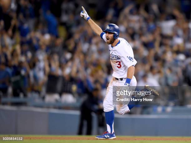 Chris Taylor of the Los Angeles Dodgers celebrates his solo homerun to win the game 3-2 over the Colorado Rockies during the 10th inning at Dodger...