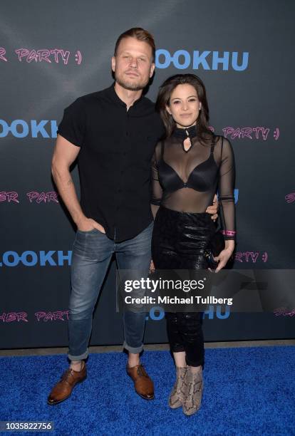 Aaron Schwartz and guest attend the premiere party for LookHu's "Slasher Party" at ArcLight Hollywood on September 18, 2018 in Hollywood, California.