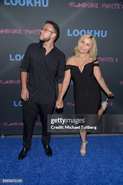 Tony Villalobos and Simona Shyne attend the premiere party for LookHu's "Slasher Party" at ArcLight Hollywood on September 18, 2018 in Hollywood,...