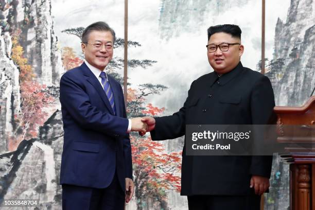 South Korean President Moon Jae-in ashakes hands with North Korean leader Kim Jong Un during a joint press conference at Paekhwawon State Guesthouse...