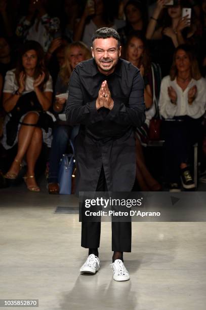 Designer Alberto Zambelli acknowledges the applause of the audience after his show during Milan Fashion Week Spring/Summer 2019 on September 19, 2018...
