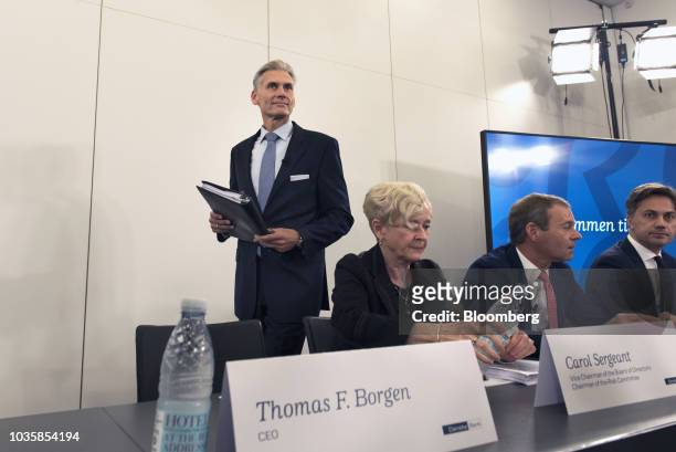 Thomas Borgen, chief executive officer of Danske Bank A/S, left, arrives for a news conference with Carole Sergeant, vice chairman of Danske Bank...