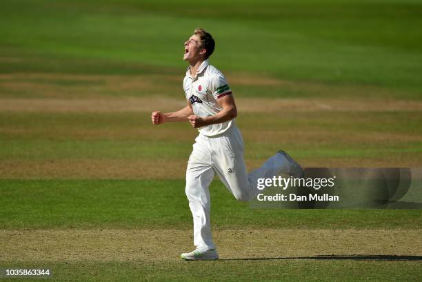 Tom Abell of Somerset celebrates taking the wicket of Dean Elgar of Surrey during day two of the Specsavers County Championship Division One match...