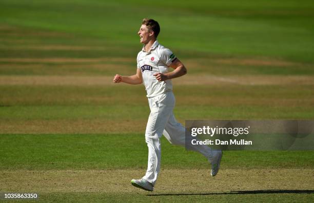 Tom Abell of Somerset celebrates taking the wicket of Dean Elgar of Surrey during day two of the Specsavers County Championship Division One match...