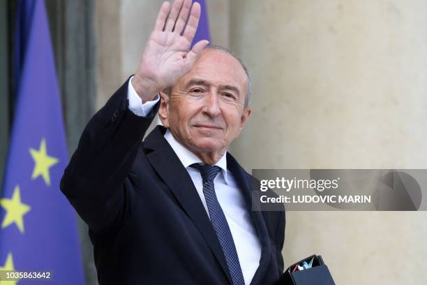 French Interior Minister Gerard Collomb waves as he leaves the Elysee palace, after the weekly cabinet meeting, on September 19, 2018 in Paris.
