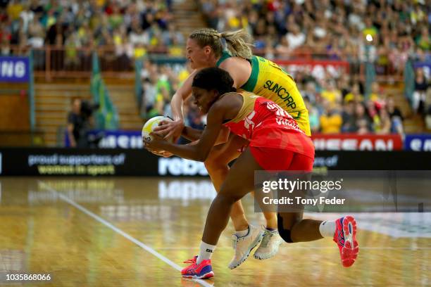 Caitlin Bassett of the Diamonds contests the ball with Jodie Gibson of England during the Quad Series International Netball test match between the...