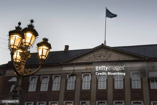 Flag flies above the headquarters of Danske Bank A/S in Copenhagen, Denmark, on Tuesday, Sept. 18, 2018. Danske Bank A/S Chief Executive...