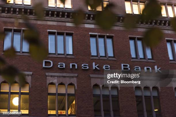 Logo sits on display outside the Danske Bank A/S finance center in Copenhagen, Denmark, on Tuesday, Sept. 18, 2018. Danske Bank A/S Chief Executive...