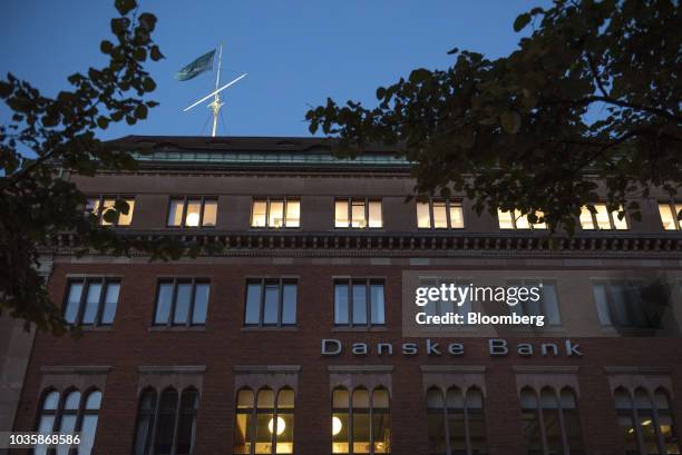 Flag flies above the Danske Bank A/S finance center in Copenhagen, Denmark, on Tuesday, Sept. 18, 2018. Danske Bank A/S Chief Executive...