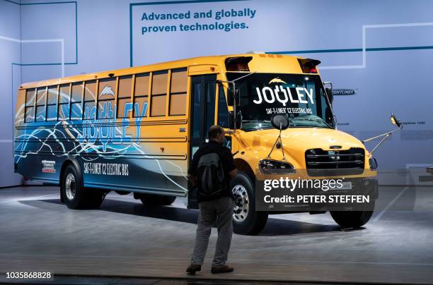 An electric school bus by Daimler Trucks North America is on display at the IAA Commercial Vehicles fair on September 19, 2018 in Hanover, northern...