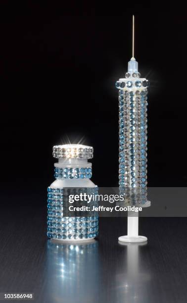 syringe studded with rhinestones - rhinestone stock pictures, royalty-free photos & images