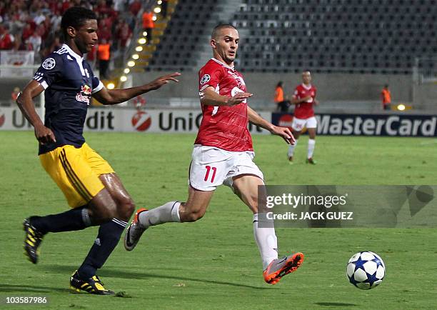 Defender David Mendes da Silva of Austria's Red Bull Salzburg, fights for a ball against forward Ben Sahar of Israel's Hapoel Tel Aviv, during their...