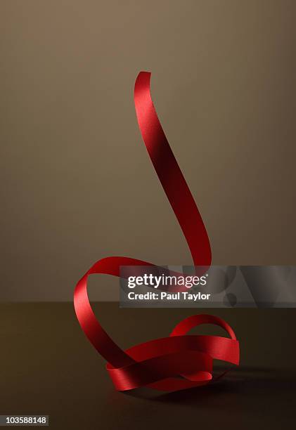 red ribbon - celebrate ribbon stock pictures, royalty-free photos & images