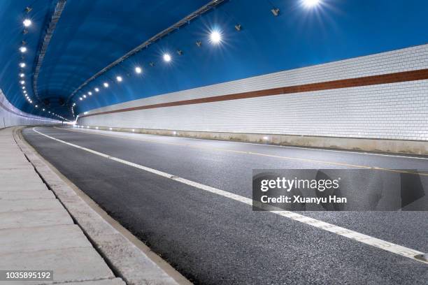 modern highway tunnel underpass - strassenunterführung stock-fotos und bilder