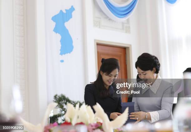 Ri Sol Ju , wife of North Korean leader Kim Jong Un, and Kim Jung-sook, the, wife of South Korean President Moon Jae-in, talk during a lunch at the...