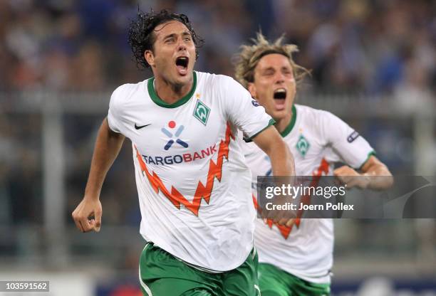Claudio Pizarro of Bremen celebrates with his team mate Clemens Fritz after scoring his team's second goal during the Uefa Champions League...