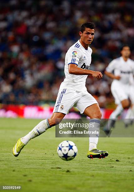 Cristiano Ronaldo of Real Madrid passes the ball during the Santiago Bernabeu Trophy between Real Madrid and Penarol on August 24, 2010 in Madrid,...