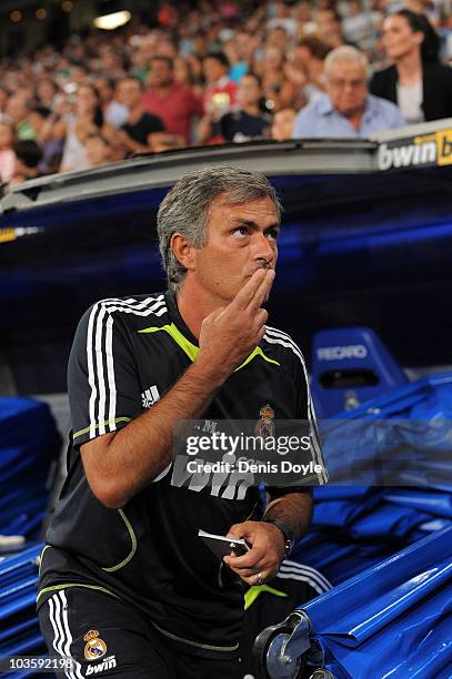 Real Madrid manager Jose Mourinho takes his place before the start of the Santiago Bernabeu Trophy match between Real Madrid and Penarol at the...