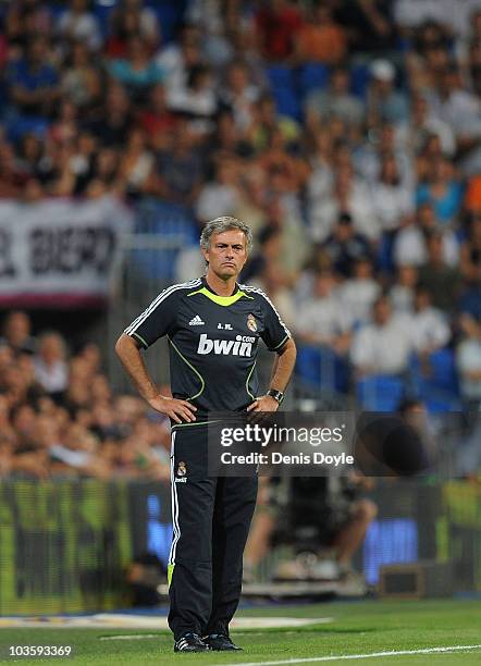 Real Madrid's new manager Jose Mourinho watches his team during the Santiago Bernabeu Trophy match between Real Madrid and Penarol at the Santiago...