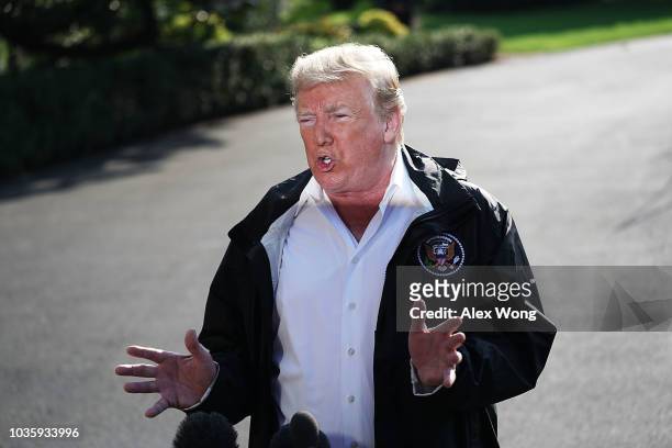 President Donald Trump speaks to members of the media prior to a Marine One departure at the South Lawn of the White House September 19, 2018 in...