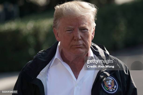 President Donald Trump speaks to members of the media prior to a Marine One departure at the South Lawn of the White House September 19, 2018 in...