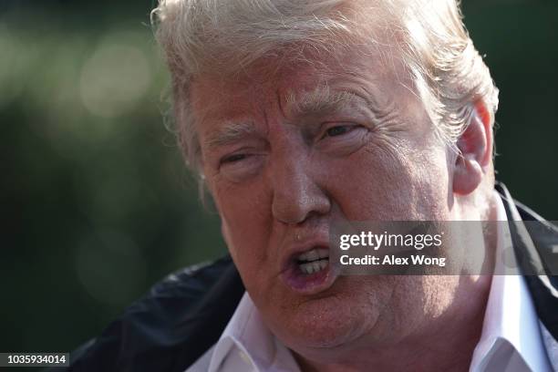 President Donald Trump speaks to members of the media prior to a Marine One departure at the South Lawn of the White House September 19, 2018 in...