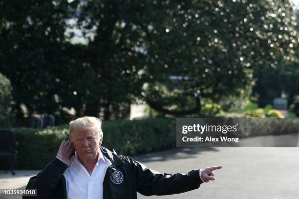 President Donald Trump speaks to members of the media prior to a Marine One departure at the South Lawn of the White House September 19, 2018 in...