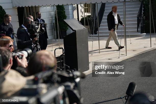 President Donald Trump comes out from the residence prior to a Marine One departure at the South Lawn of the White House September 19, 2018 in...