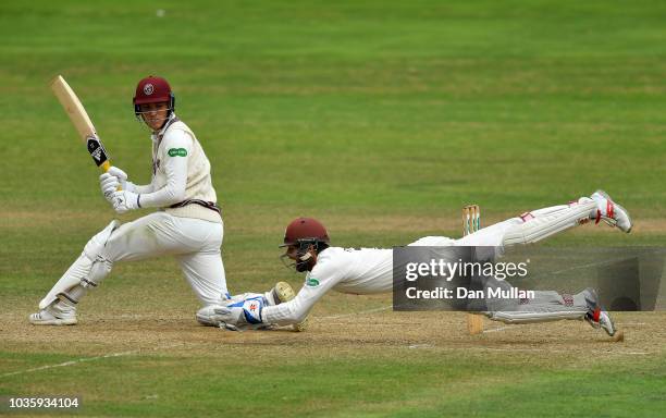 Tom Banton of Somerset is caught by Ben Foakes of Surrey during day two of the Specsavers County Championship Division One match between Somerset and...