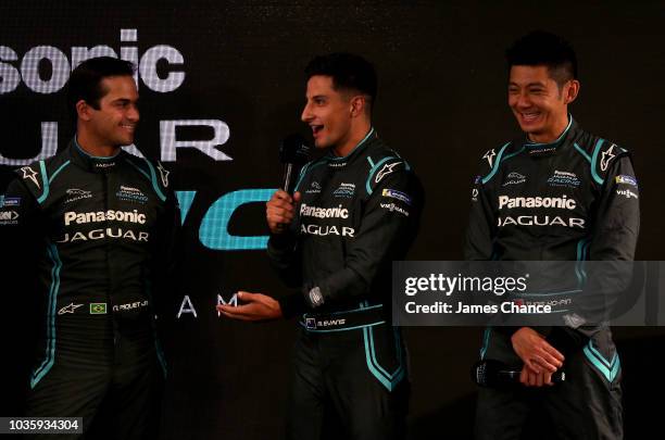 Mitch Evans of Jaguar Racing speaks as Ho-Pin Tung of Jaguar Racing and Nelson Piquet Jr of Jaguar Racing react during the Jaguar Racing team ABB FIA...