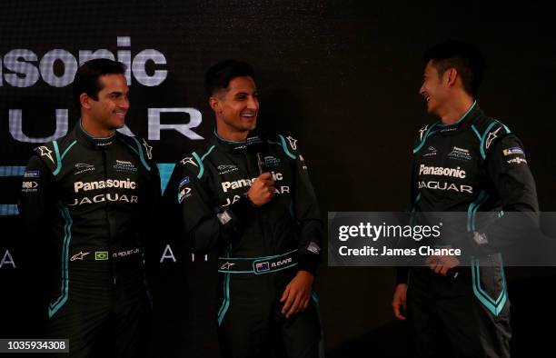 Mitch Evans of Jaguar Racing speaks as Ho-Pin Tung of Jaguar Racing and Nelson Piquet Jr of Jaguar Racing react during the Jaguar Racing team ABB FIA...