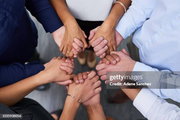 each member forms an integral link to the group - hold hands circle stock pictures, royalty-free photos & images