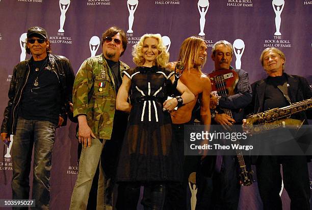 Inductee Madonna poses with Scott Asheton, Ron Asheton, Iggy Pop, Mike Watt and Steve MacKay of The Stooges in the press room during the 23rd Annual...