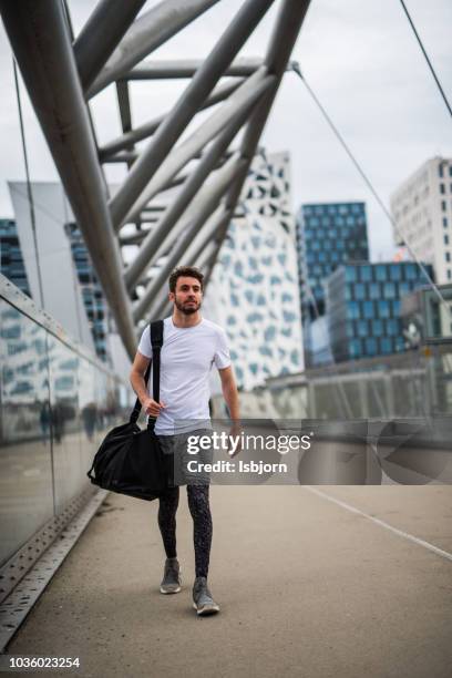 athlete going in the gym. - duffle bag stock pictures, royalty-free photos & images