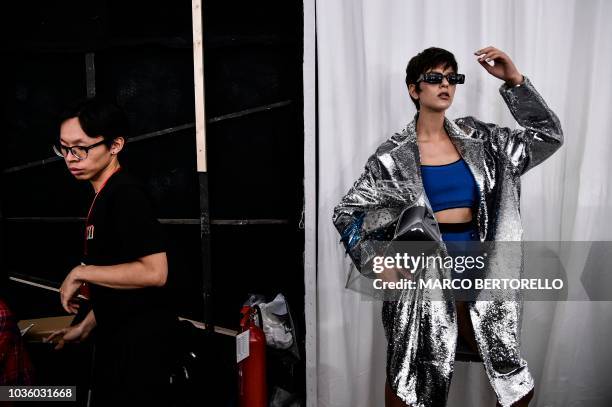 Model poses backstage before presenting creations by Annakiki during the Women's Spring/Summer 2019 fashion shows in Milan, on September 19, 2018.