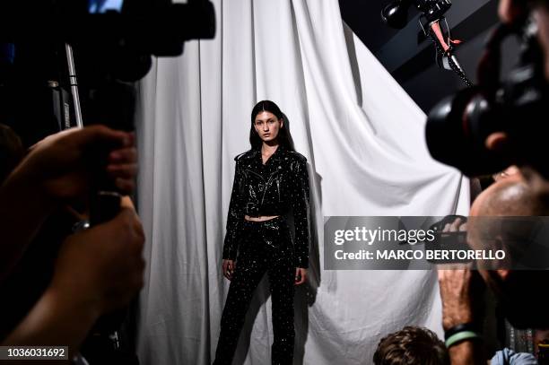 Model poses backstage before presenting creations by Annakiki during the Women's Spring/Summer 2019 fashion shows in Milan, on September 19, 2018.