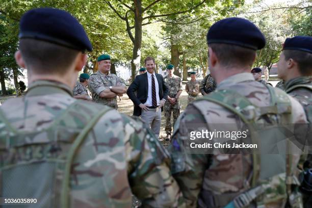 Prince Harry, Duke of Sussex meets commandos as he visits The Royal Marines Commando Training Centre on September 13, 2018 in Lympstone, United...